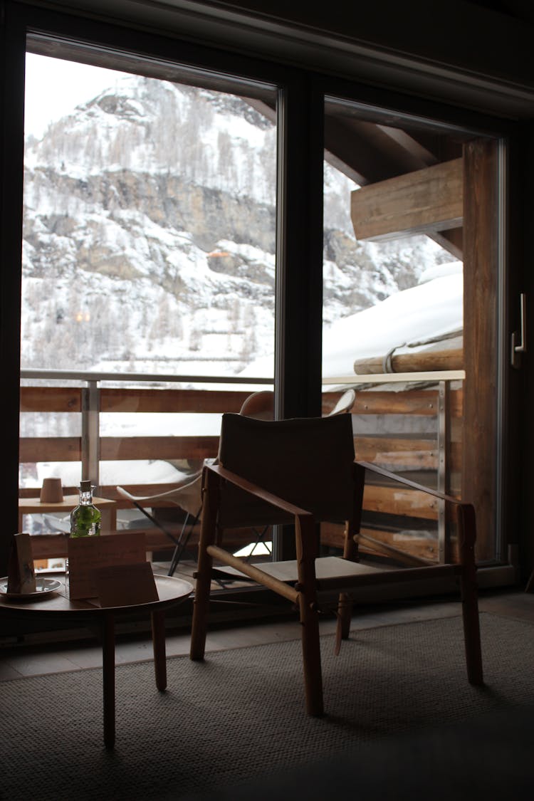 A Chair By A Balcony Door