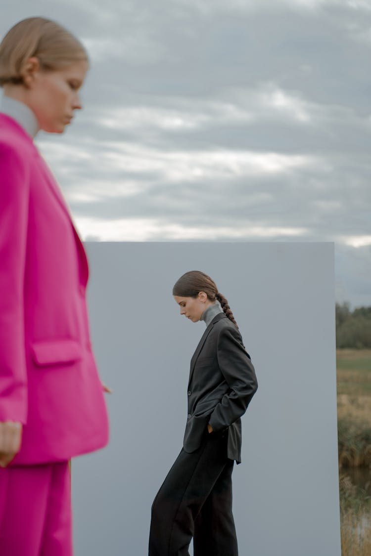 Women In Pink And Black Suits