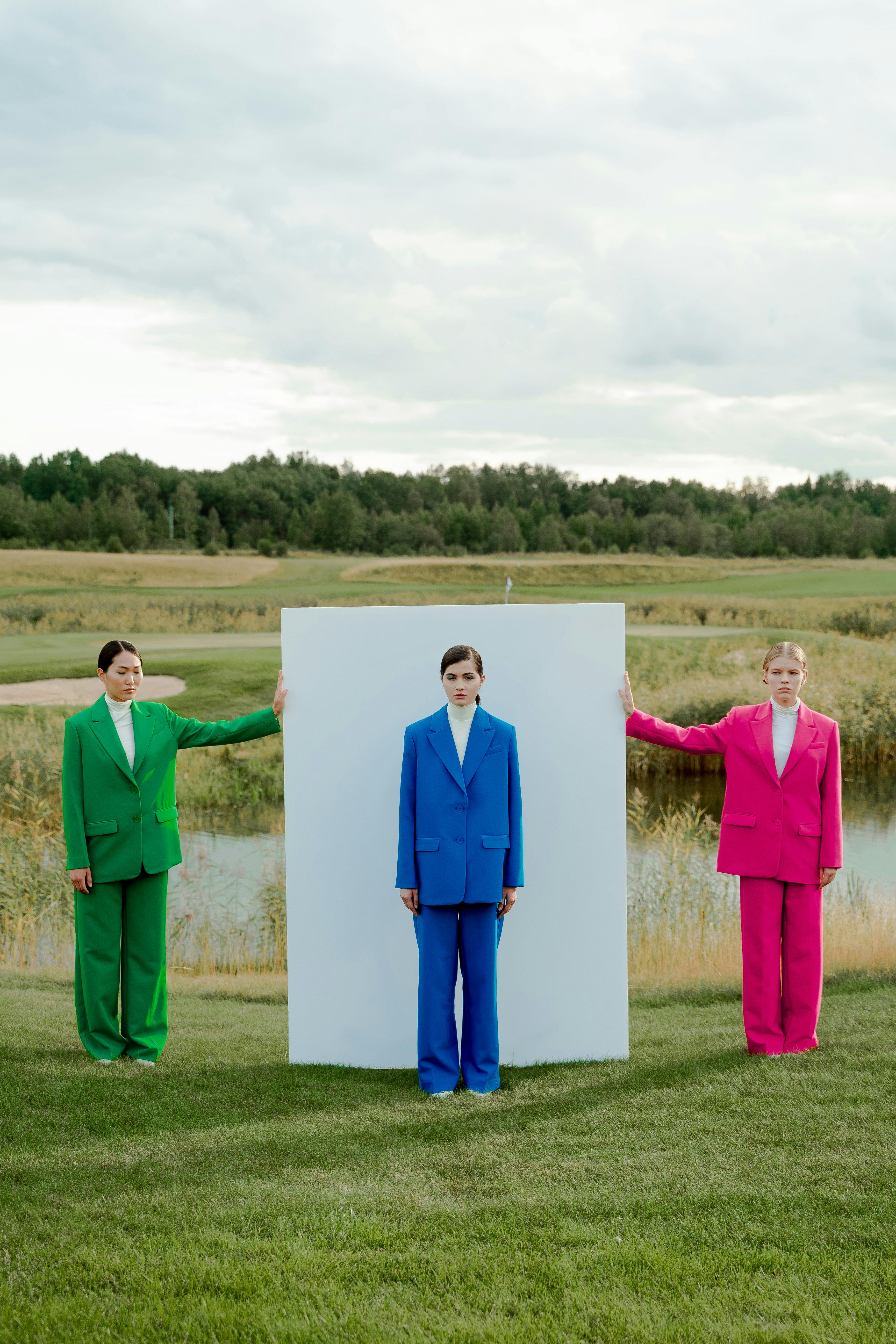 photo of women wearing colorful blazers