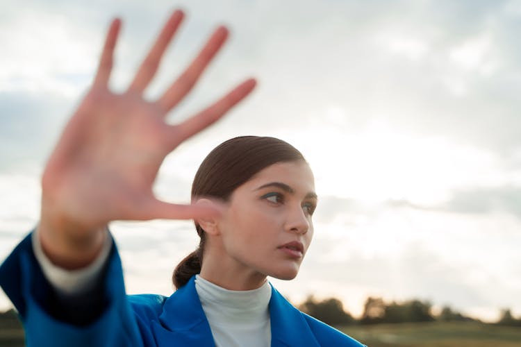 Woman Reaching Hand Ahead