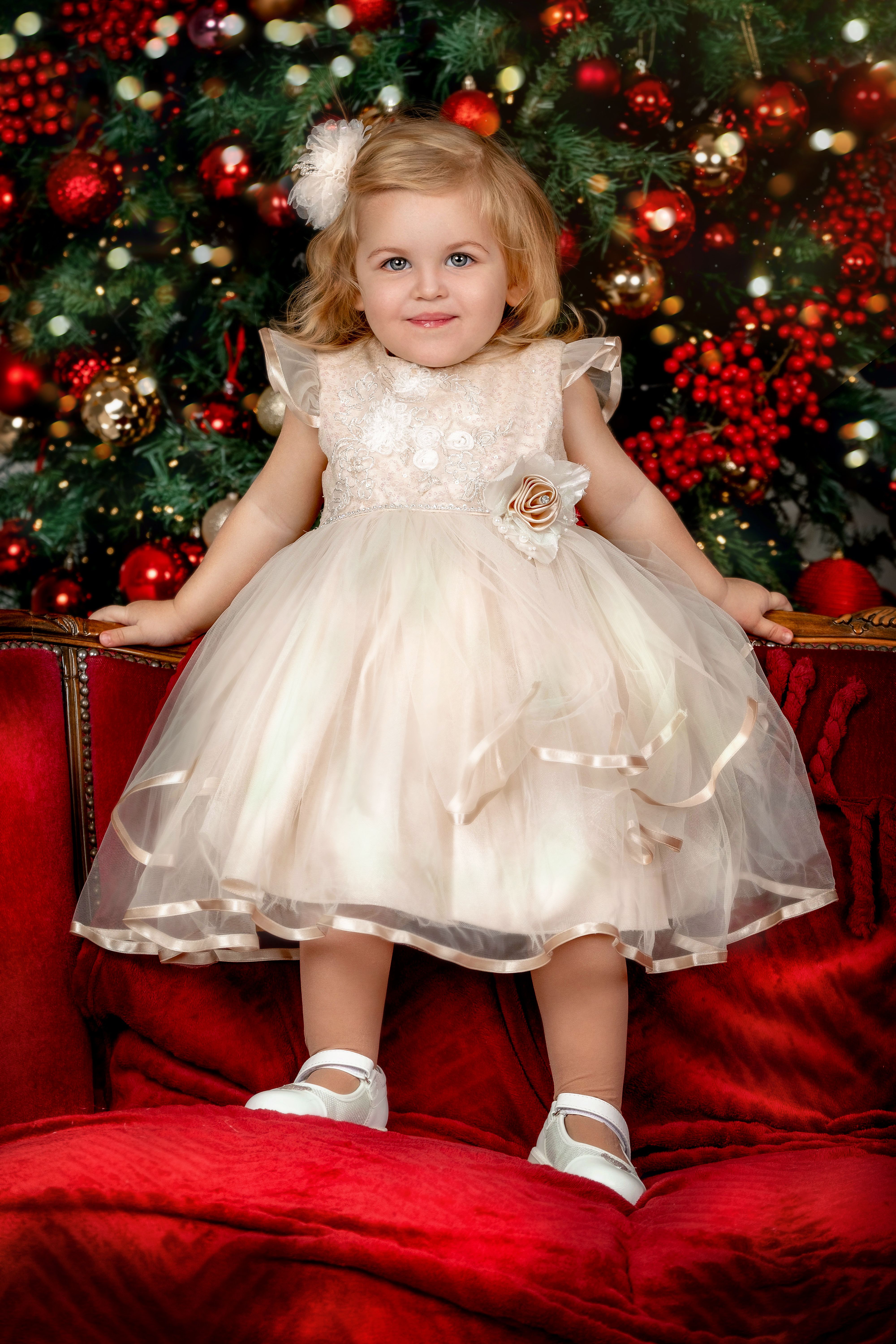 Little Girl in White Dress Standing on a Sofa · Free Stock Photo