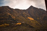 Green and Brown Mountain Under Cloudy Sky