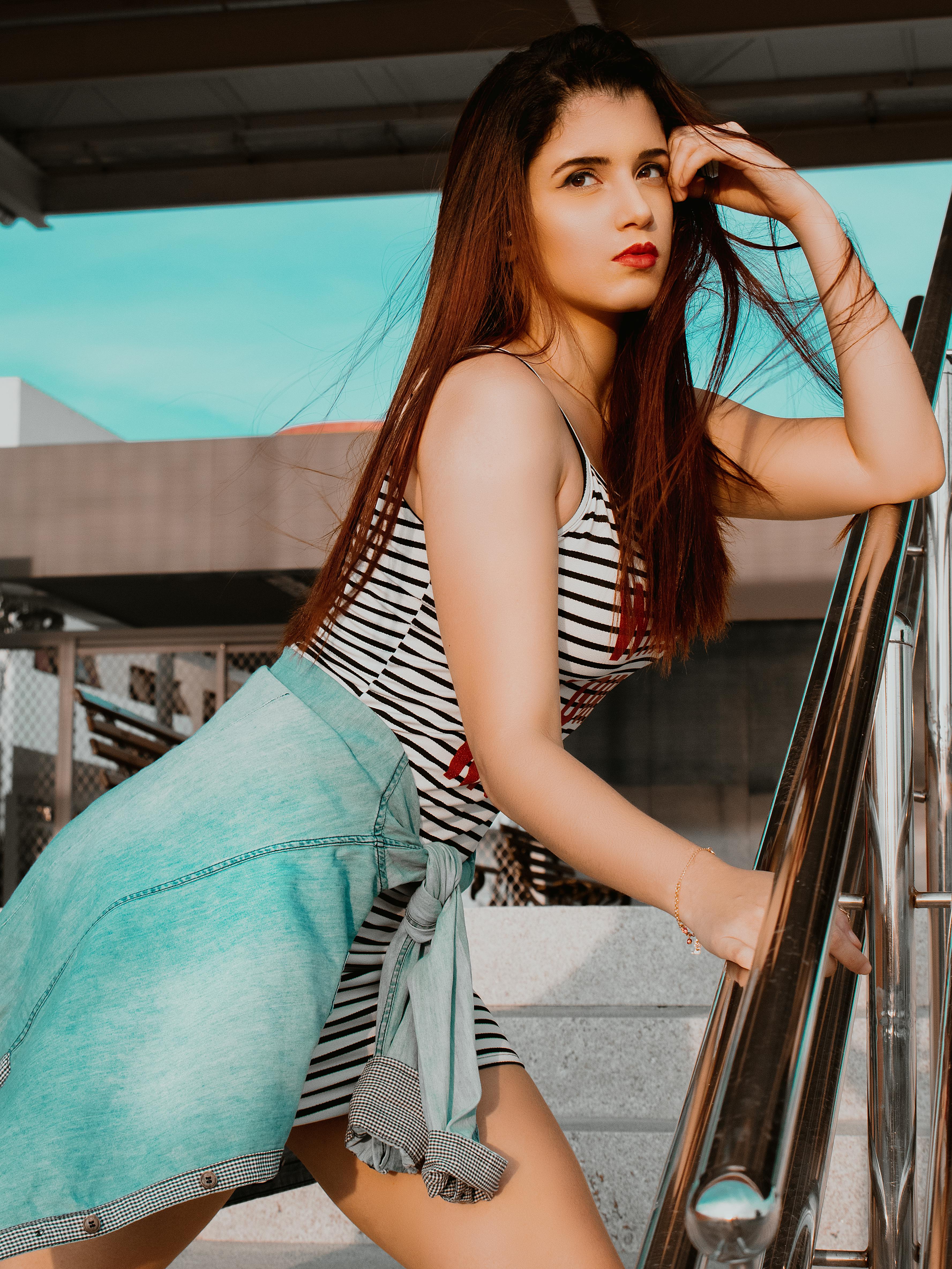 Young Brunette Woman Posing in Off Shoulder Dress · Free Stock Photo