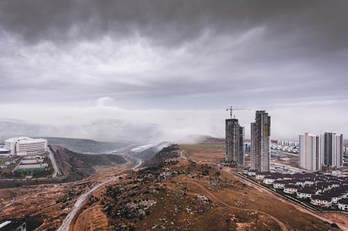 Aerial Photography of High Rise Buildings in the City under the Cloudy Sky