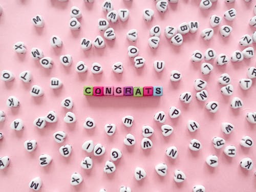 Free Congrats Text on a Pink Surface Stock Photo