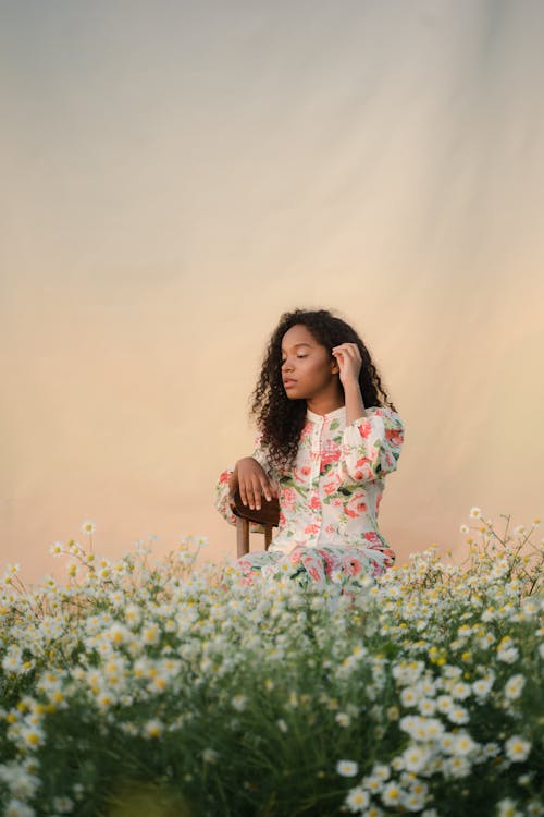 Young Woman on Flower Field 