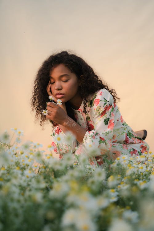 Young Woman on Flower Field 