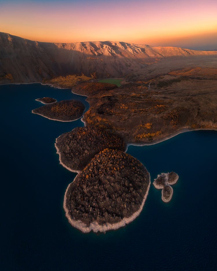 Sunset Over Volcanic Mountain And Islands