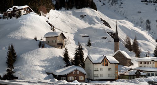 Houses on Snow-Covered Mountain