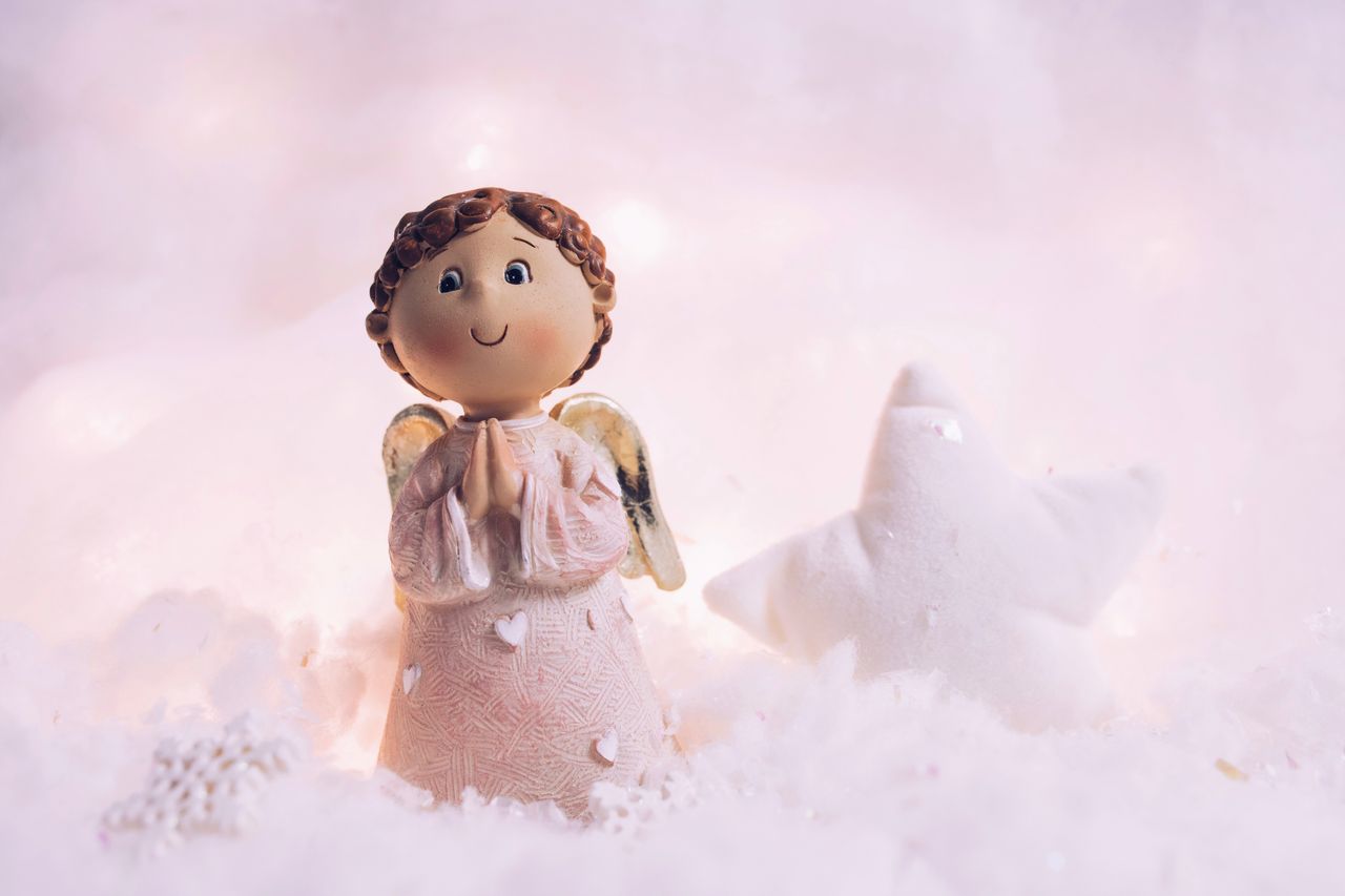 adorable angel figurine in a snowy setting radiating warmth and peace