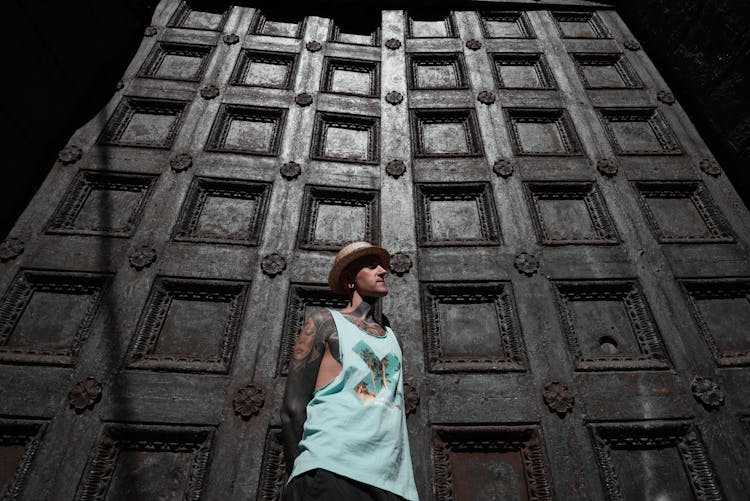 Young Man In Front Of Wooden Door 