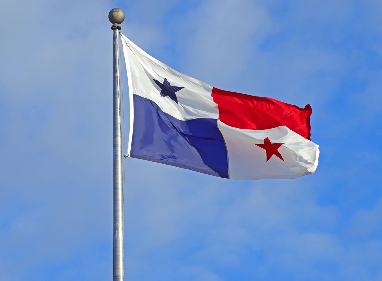 panama flag waving against a clear blue sky symbolizing patriotism and
