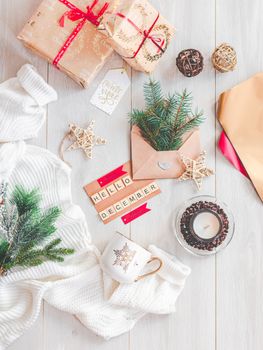 A cozy winter-themed flat lay featuring gifts, decorations, and a cozy sweater for a perfect festive atmosphere.. pexels, coz