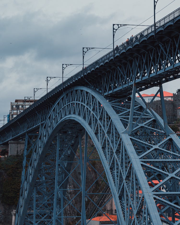 A Metal Bridge With Arch Shaped Below