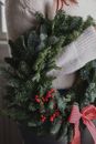 Green Pine Tree With Red and White Ribbon