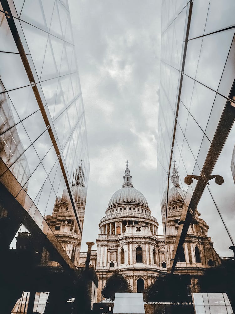 View On Renaissance Basilica Reflecting In Glass Facades Of Modern Buildings