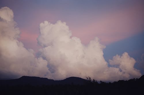 Free White Clouds over Mountain Stock Photo