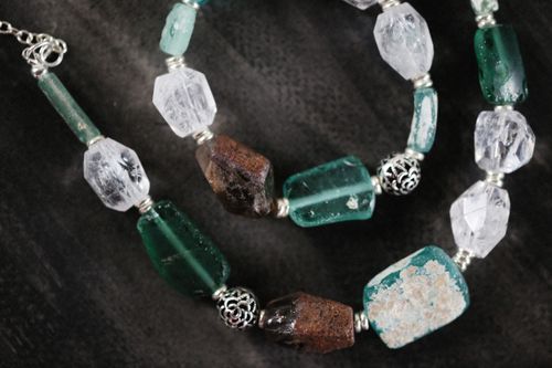 Free Artistic close-up of luxury gemstone beads in a bracelet, featuring green and clear textures. Stock Photo