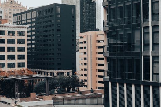 Cityscape view of Fort Worth, TX featuring downtown high-rise buildings in an autumn setting.