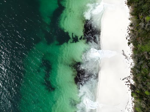 Aerial Photography of Sea Waves Crashing on the Sea Shore