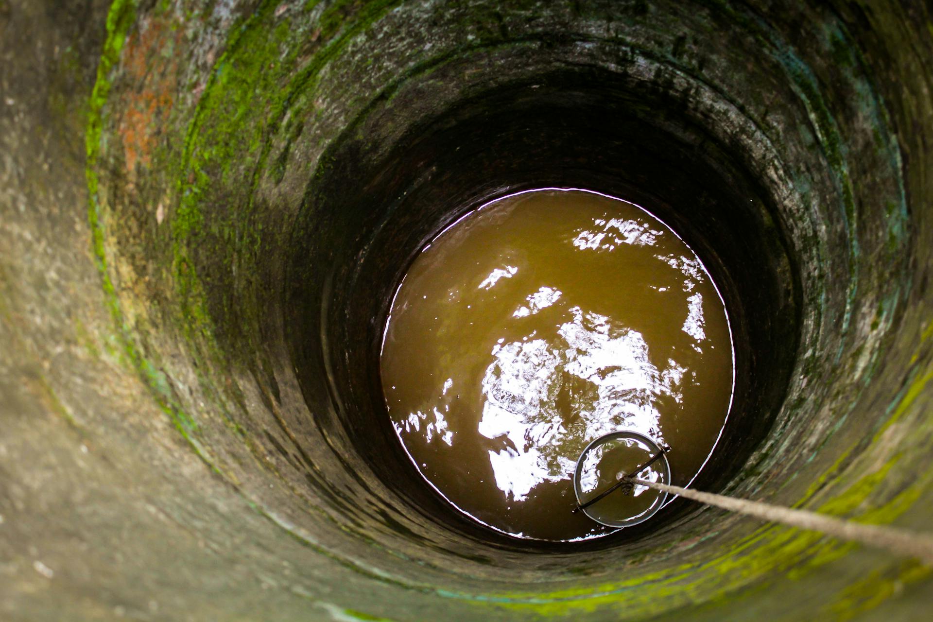 Bucket Lowered on Rope into Well