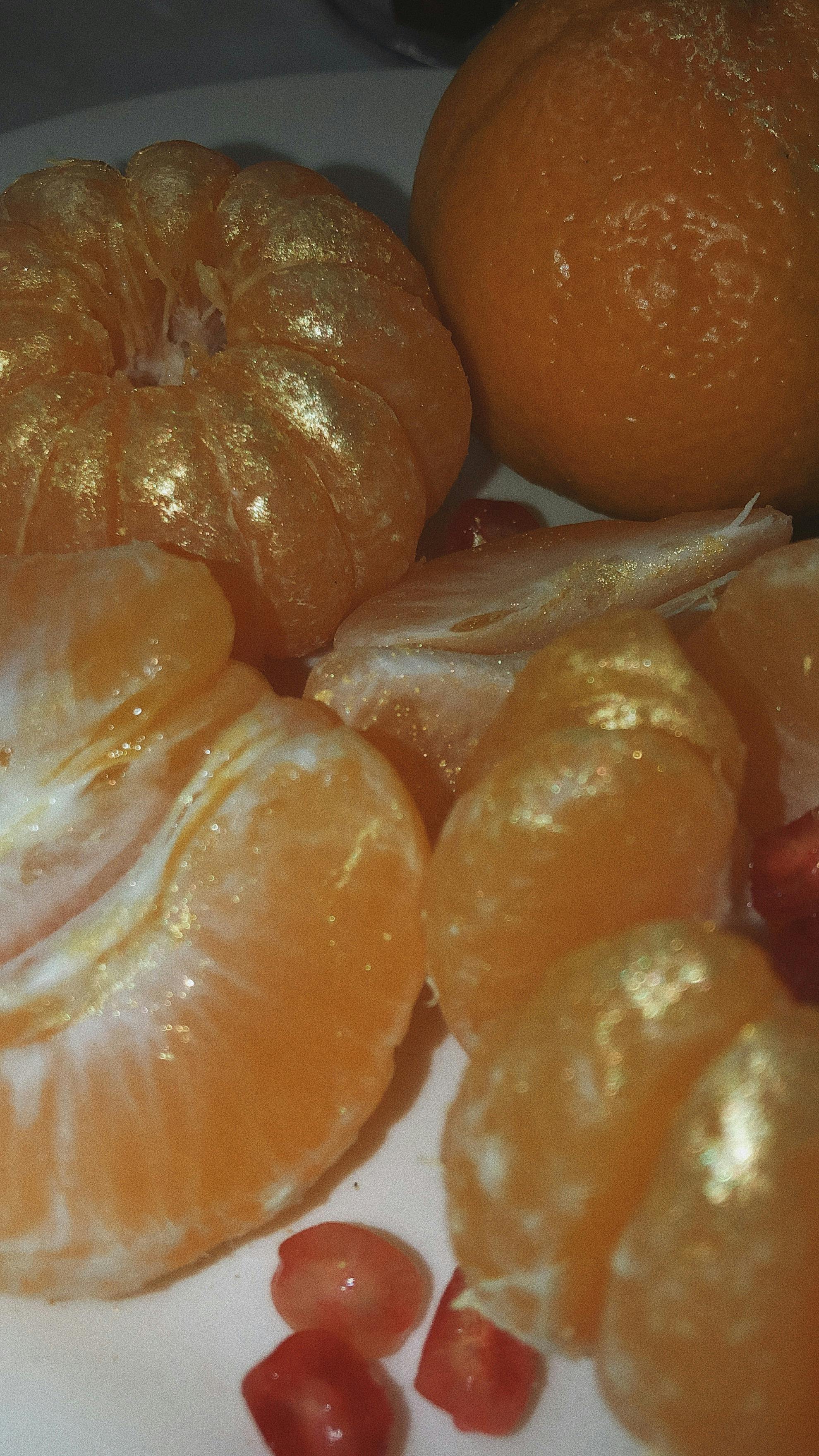 peeled orange fruits on white ceramic plate