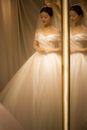 Mirror Images of a Woman in a White Wedding Gown