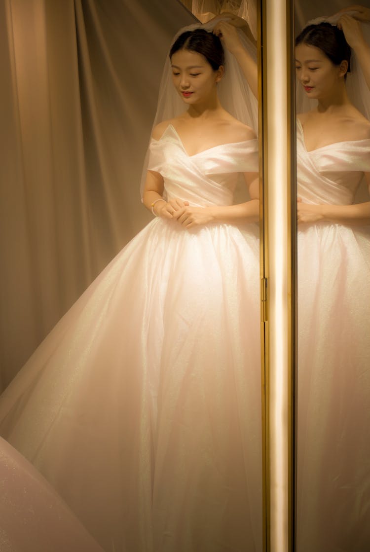 Mirror Images Of A Woman In A White Wedding Gown