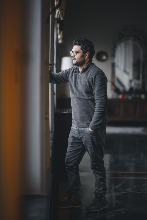 A Man in Gray Sweater Standing with His Hand on His Pocket · Free Stock ...