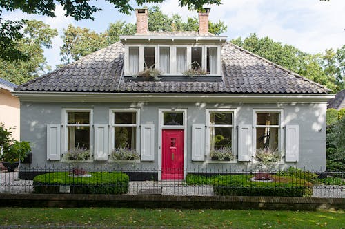 Free House with a Red Door Stock Photo