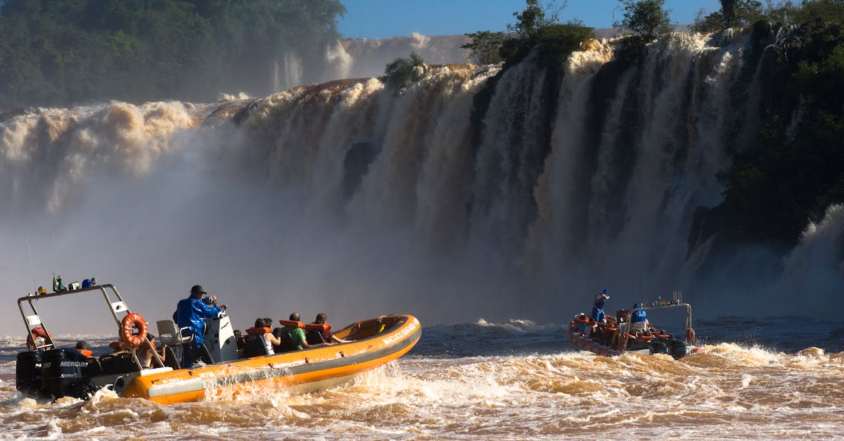 People Riding Motorized Rubber Rafts in the Rapid · Free Stock Photo