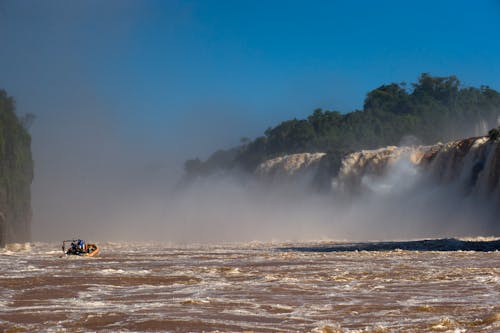 Raft on Water Near Waterfalls