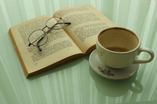 Book and an Empty Cup