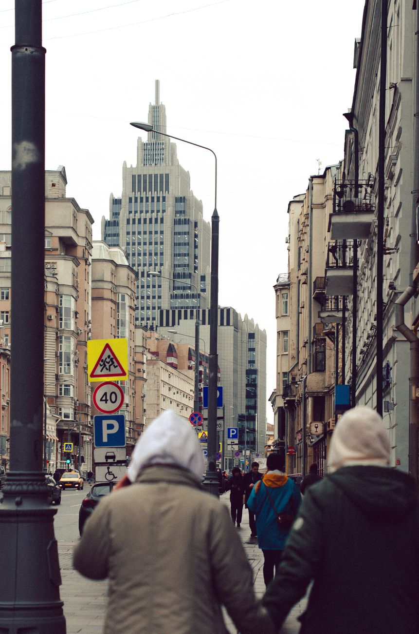 Pedestrians walk through central Moscow as tighter wartime controls spill into daily life.