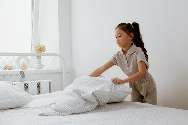 Girl Making Bed