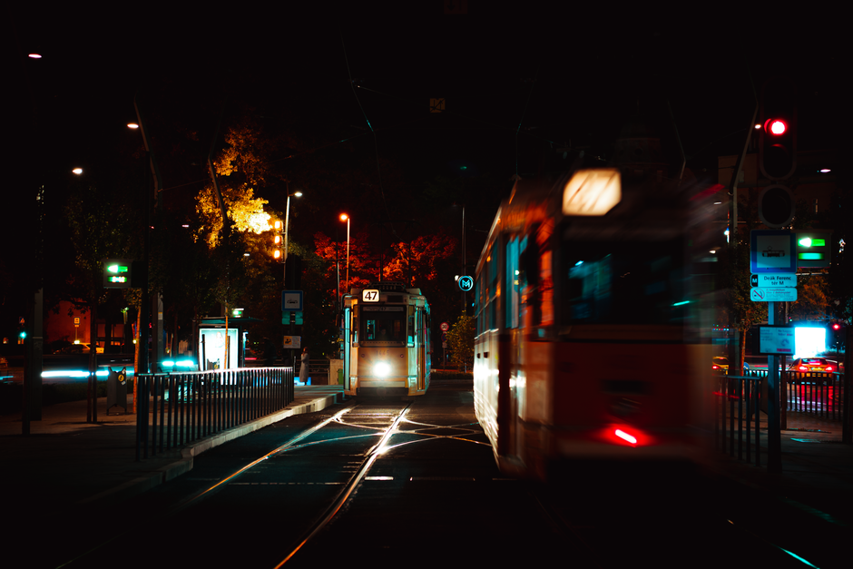 A yellow tram in Budapest, Hungary, with historic buildings in the background
