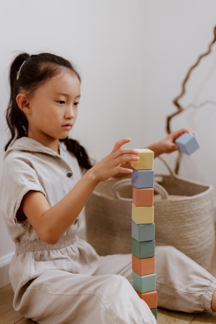 Girl Playing With Blocks