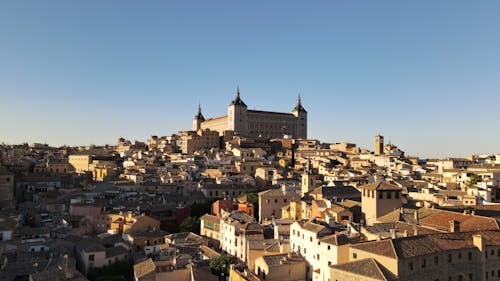 Brown and White Concrete Buildings Under Blue Sky