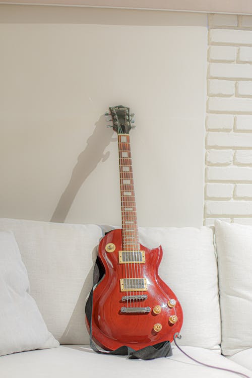 Electric Guitar on White Sofa