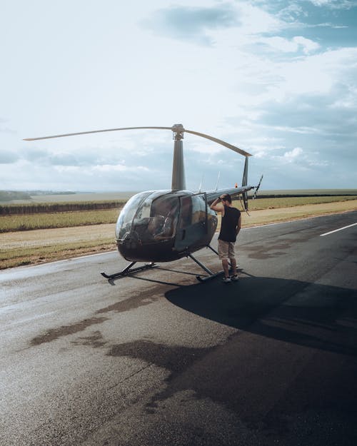 Man Standing Beside Helicopter 