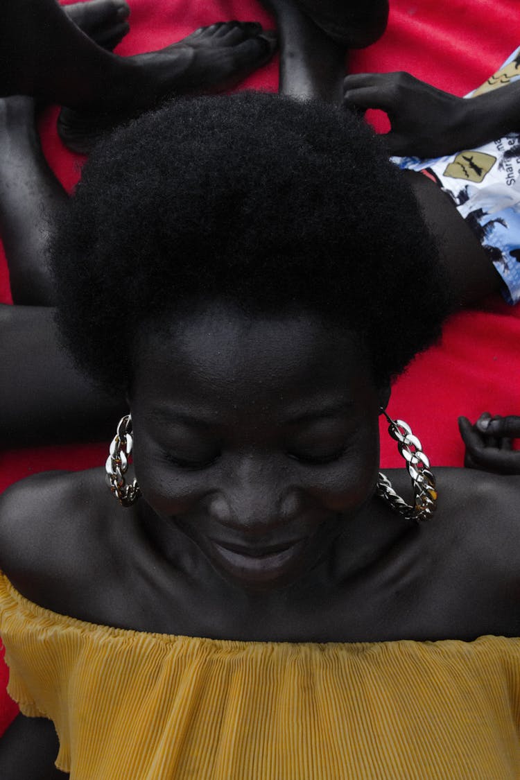 Afro-American Woman In Yellow Summer Dress And Big Earrings