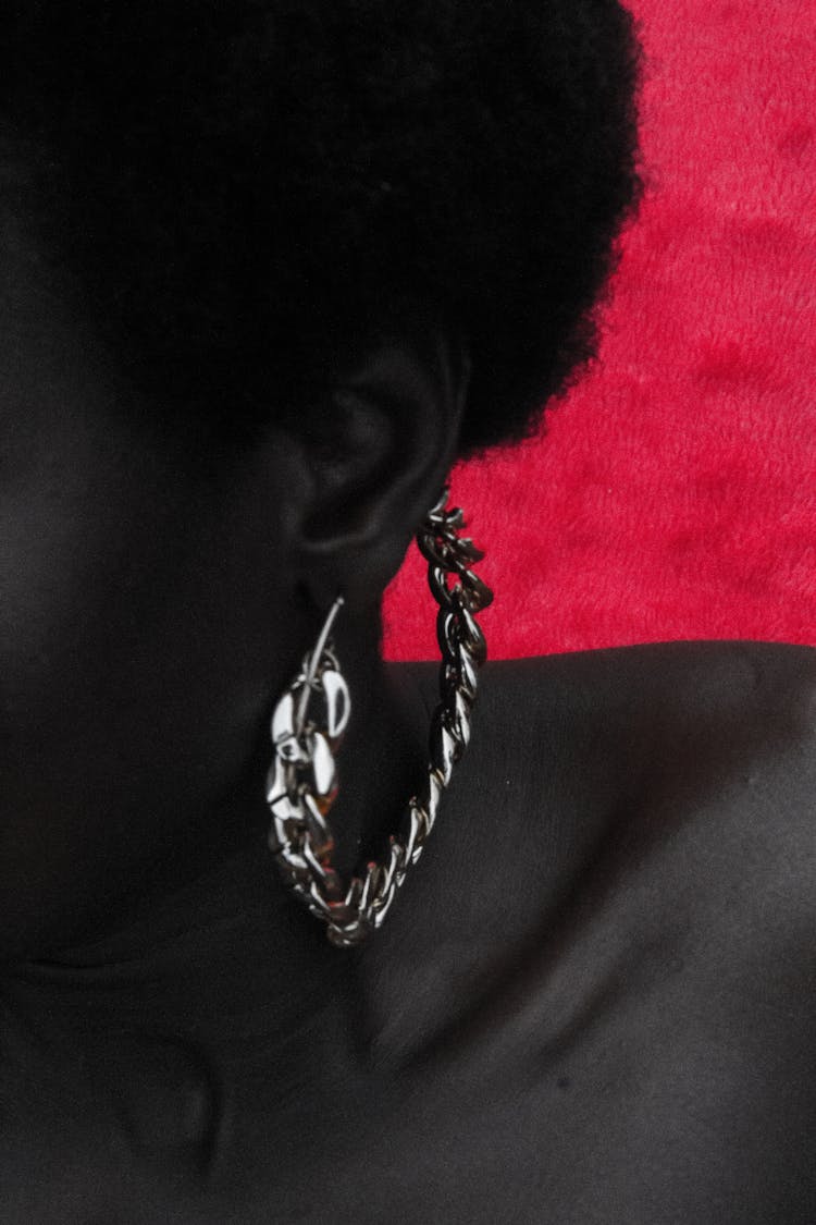 Person Wearing A Silver Hoop Earring