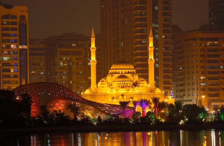 An Al Noor Mosque Surrounded With City Buildings At Night