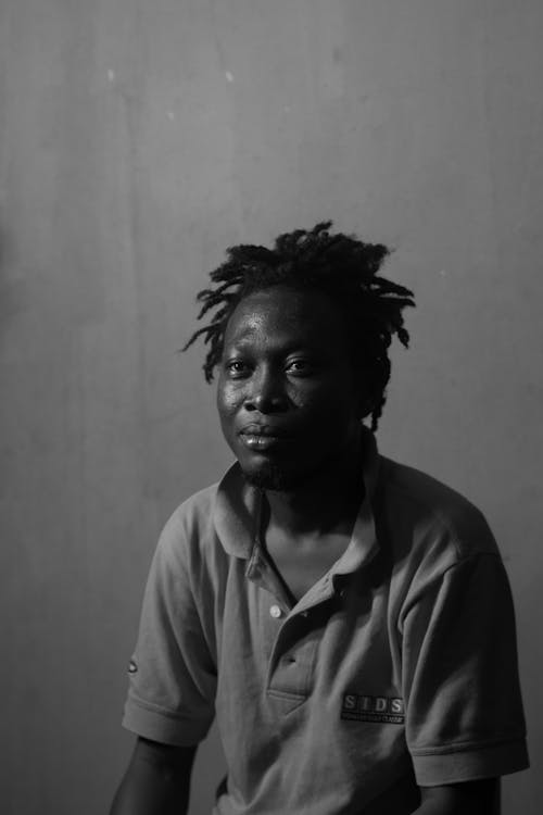 Grayscale Photo of Man Wearing a Polo Shirt