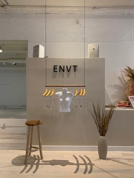 Stylish clothing store interior with minimalist design and mannequin display, New York.