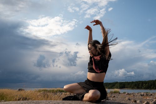 Woman Dancing Near the Sea