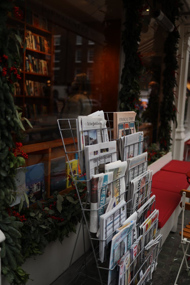 Newspapers In A Metal Rack