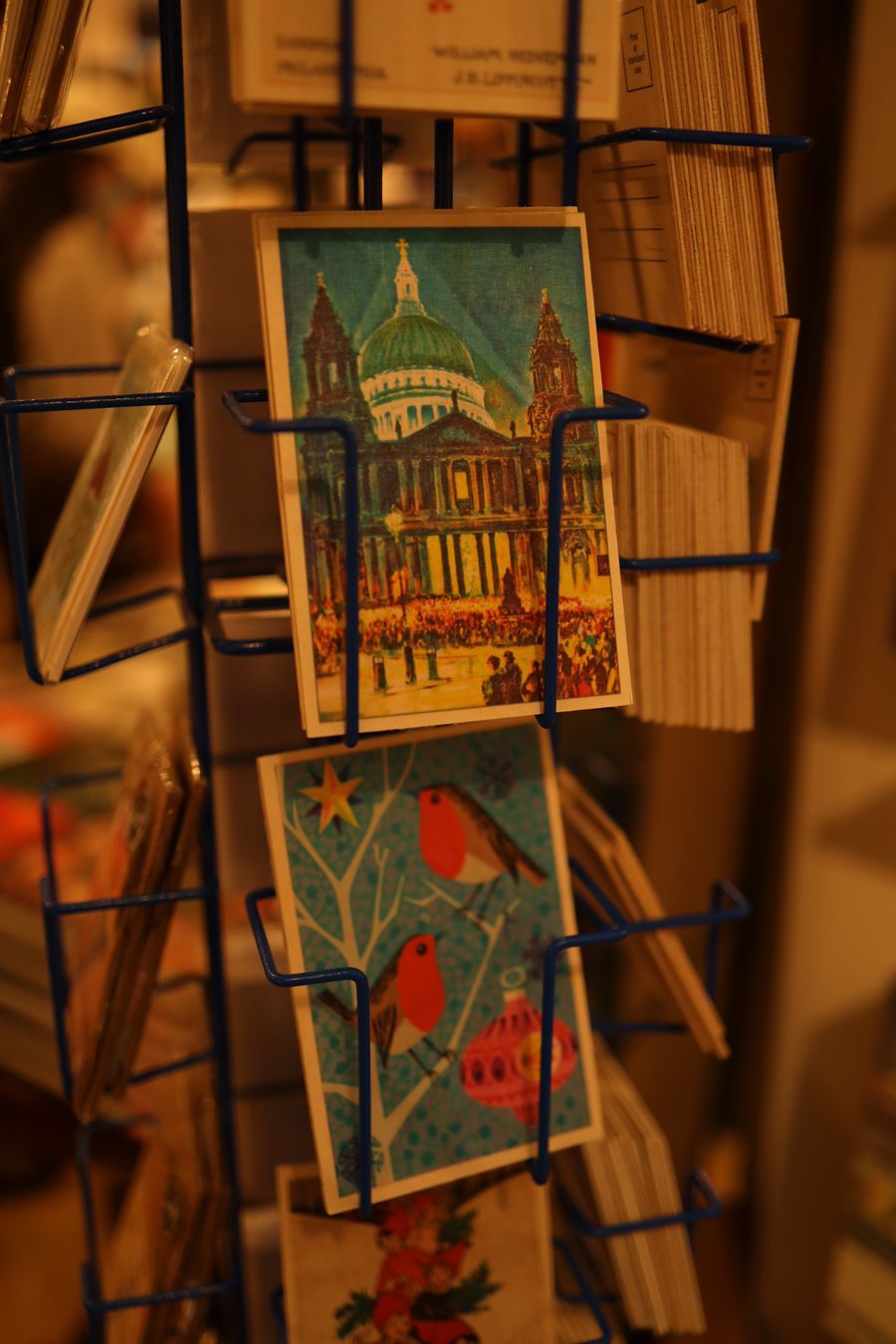 A rack of postcards standing in bright rows