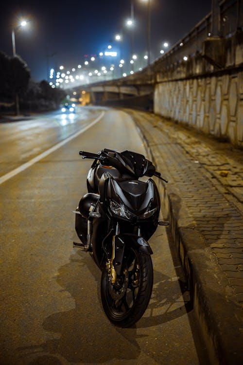 Free Black Motorcycle Parked on Road Stock Photo