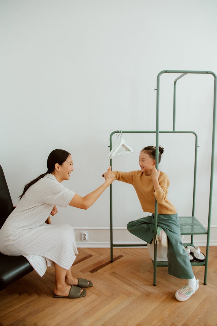 Mother And Daughter Playing 